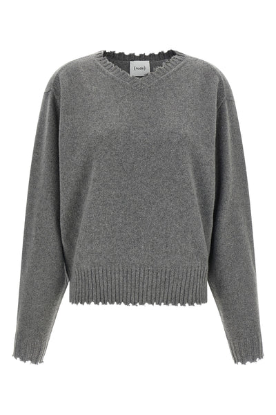 the nude v-neck sweater redefines knitwear codes through a deconstructed aesthet