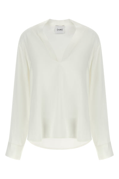 the nude blouse is distinguished by a fluid and deconstructed silhouette