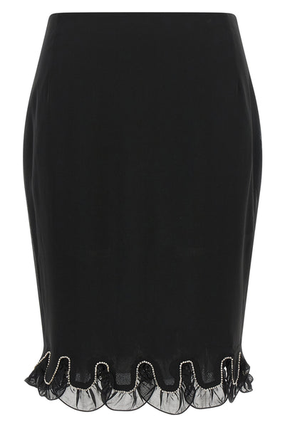 the rotate birger christensen midi skirt redefines the codes of evening elegance
