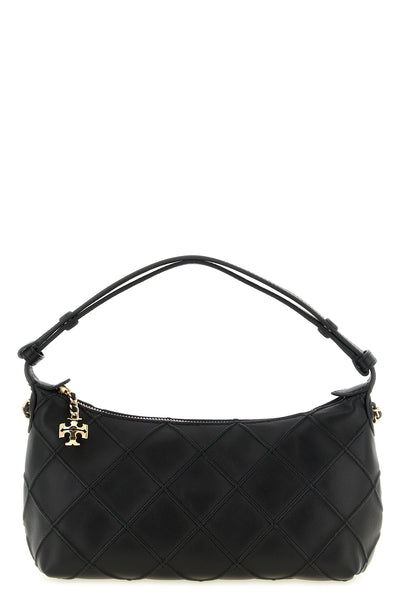 the tory burch fleming clutch redefines the codes of everyday elegance through