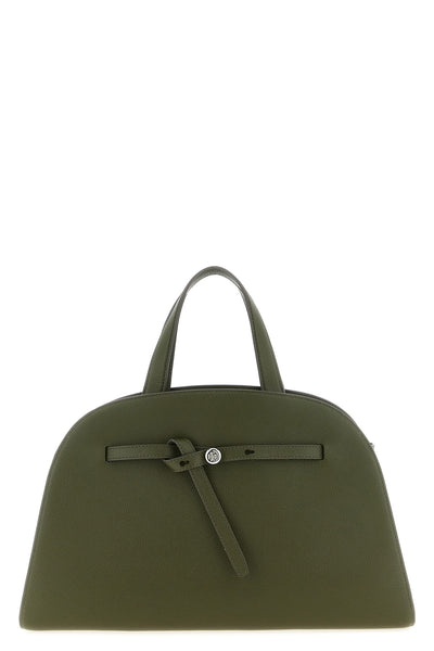 tory burchs romy top case handbag has a curved and structured silhouette
