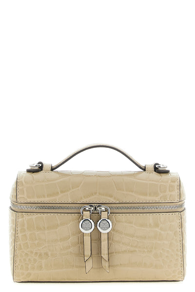 the tory burch romy slim shoulder bag stands out for its structured top case s
