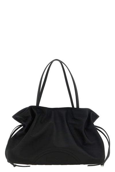 the tory burch ella drawstring shoulder bag redefines everyday volumes through