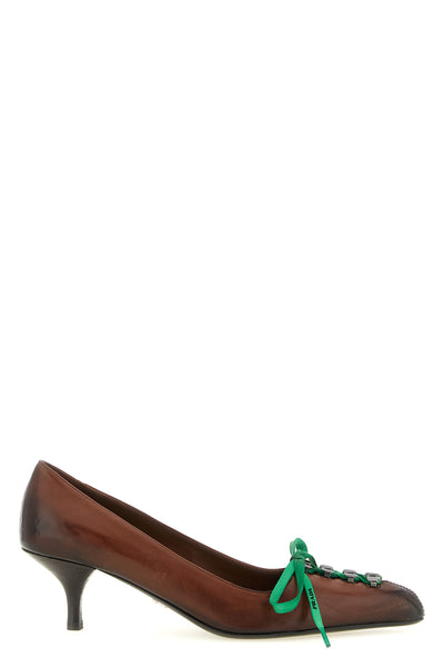 prada pumps redefine classic femininity through a bold contrast between sartoria