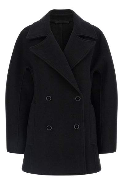 the toteme rounded peacoat coat redefines the outerwear through precise architec