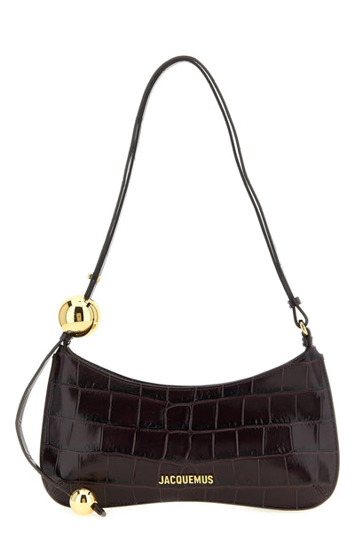 the jacquemus le bisou perle shoulder bag defines a new geometry through a cur