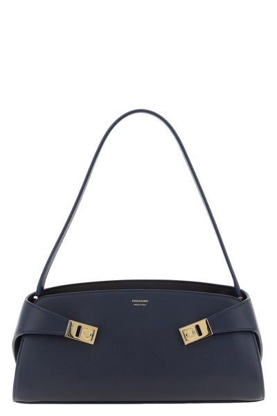 the ferragamo hug east-west shoulder bag stands out for its structured silhoue