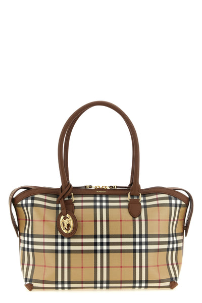 the burberry small tote bag features a structured silhouette in coated cotton ca