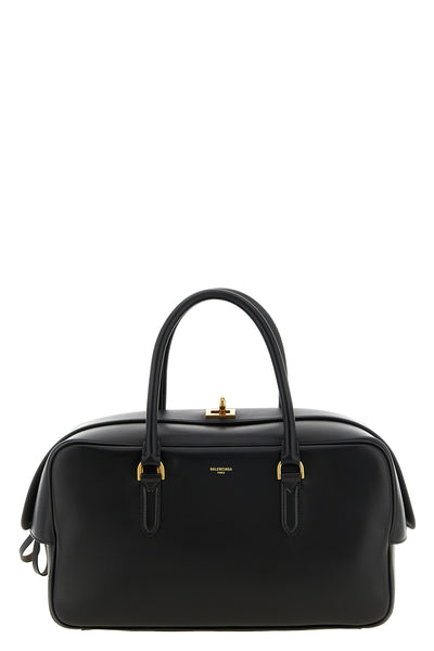 the balenciaga bowling le 7 medium handbag features a structured silhouette ma