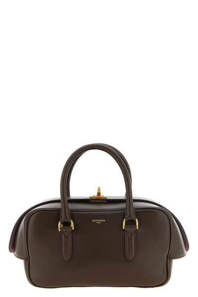 the balenciaga bowling le 7 small handbag defines a rigorous geometry of luxur
