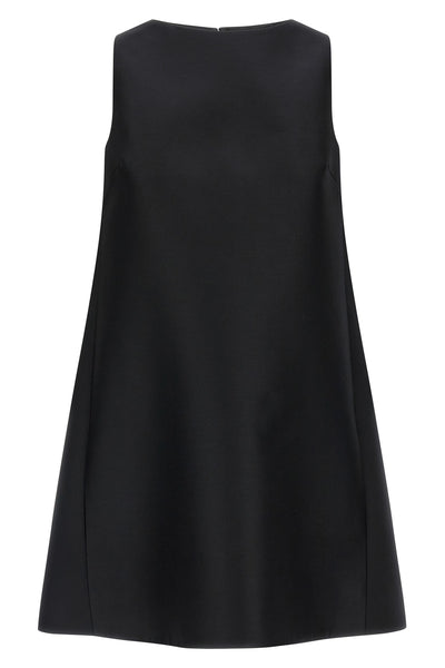 the flared balenciaga dress defines an essential silhouette through rigorous geo
