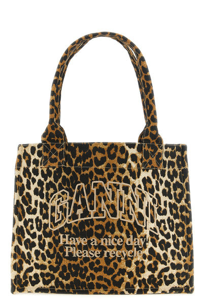 the large ganni leopard tote bag features a capacious silhouette made of cotto