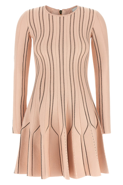 the elisabetta franchi knitted mini dress defines the silhouette through a play