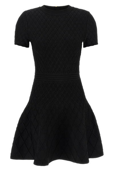 the flared balmain skater dress redefines knitwear codes through an hourglass