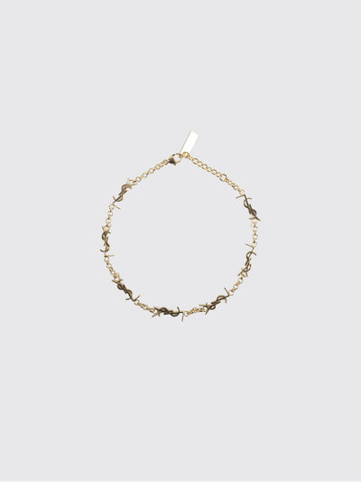 gold-tone metal bracelet with interlaced ysl monogram pendant