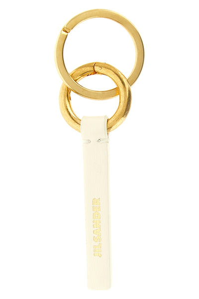 the jil sander keyring redefines essentiality through rigorous construction and
