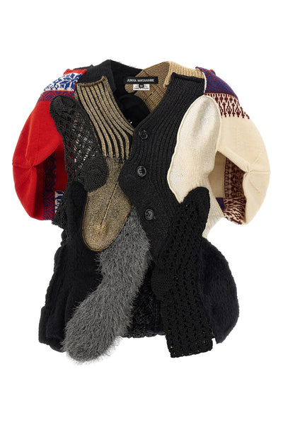 the junya watanabe cardigan is distinguished by a complex multicolored patchwork