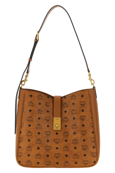 the large mcm tracy shoulder bag defines a structured aesthetic through the ic