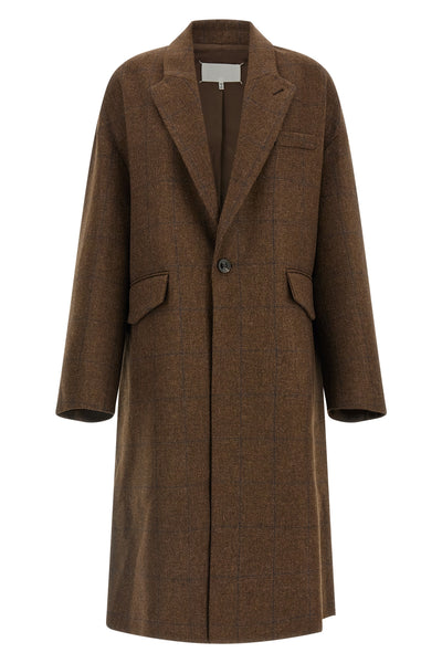 the maison margiela oversized cocooning coat redefines the proportions of the ou