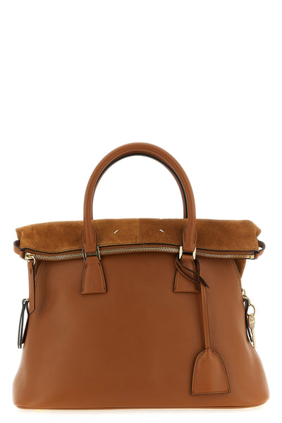 maison margiela 5ac soft medium shoulder bag explores the concept of deconstru