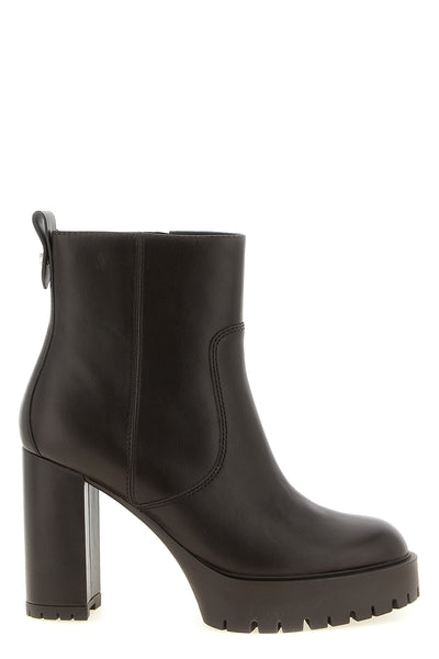 the pinko clara ankle boots define an urban silhouette through a rigorous cons