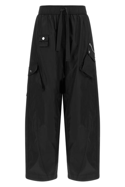 ganni multi-pocket trousers define a new urban silhouette through wide volumes a