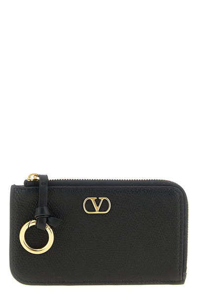 the valentino garavani coin purse and card purse represents the perfect synthesi