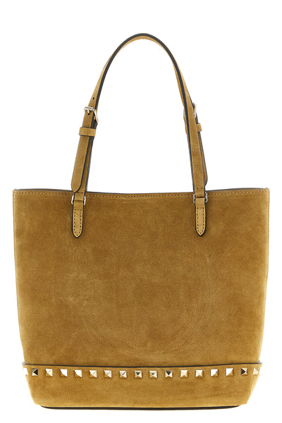 the small tote bag by valentino garavani defines a structured silhouette in fine