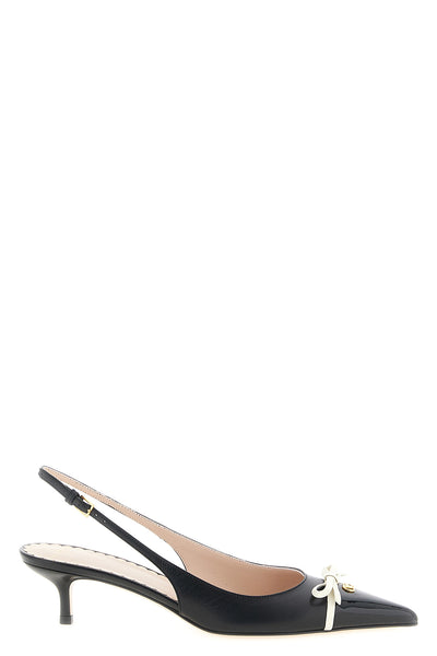 the valentino garavani slingback shoe defines a tapered model through a construc