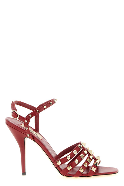 the valentino garavani rockstud high-heeled sandal defines a bold shape through