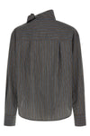 the zafrina canvas blouse redefines the codes of everyday tailoring through a
