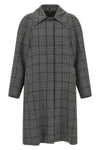 the coat tela defines the codes of contemporary outerwear through a model