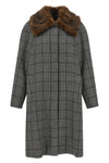 the coat tela defines the codes of contemporary outerwear through a model