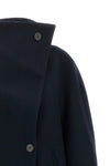 the scott coat by tela redefines the volumes of winter outerwear through a cocoo