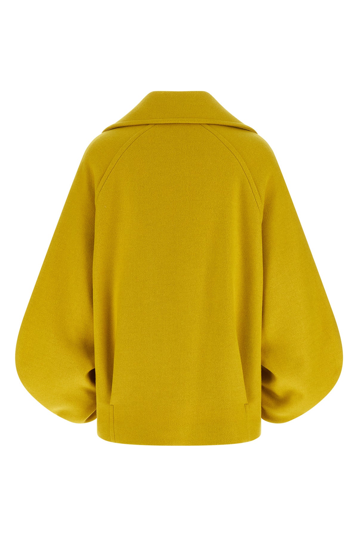 the seth tela coat redefines the outerwear through a bold and structured silho