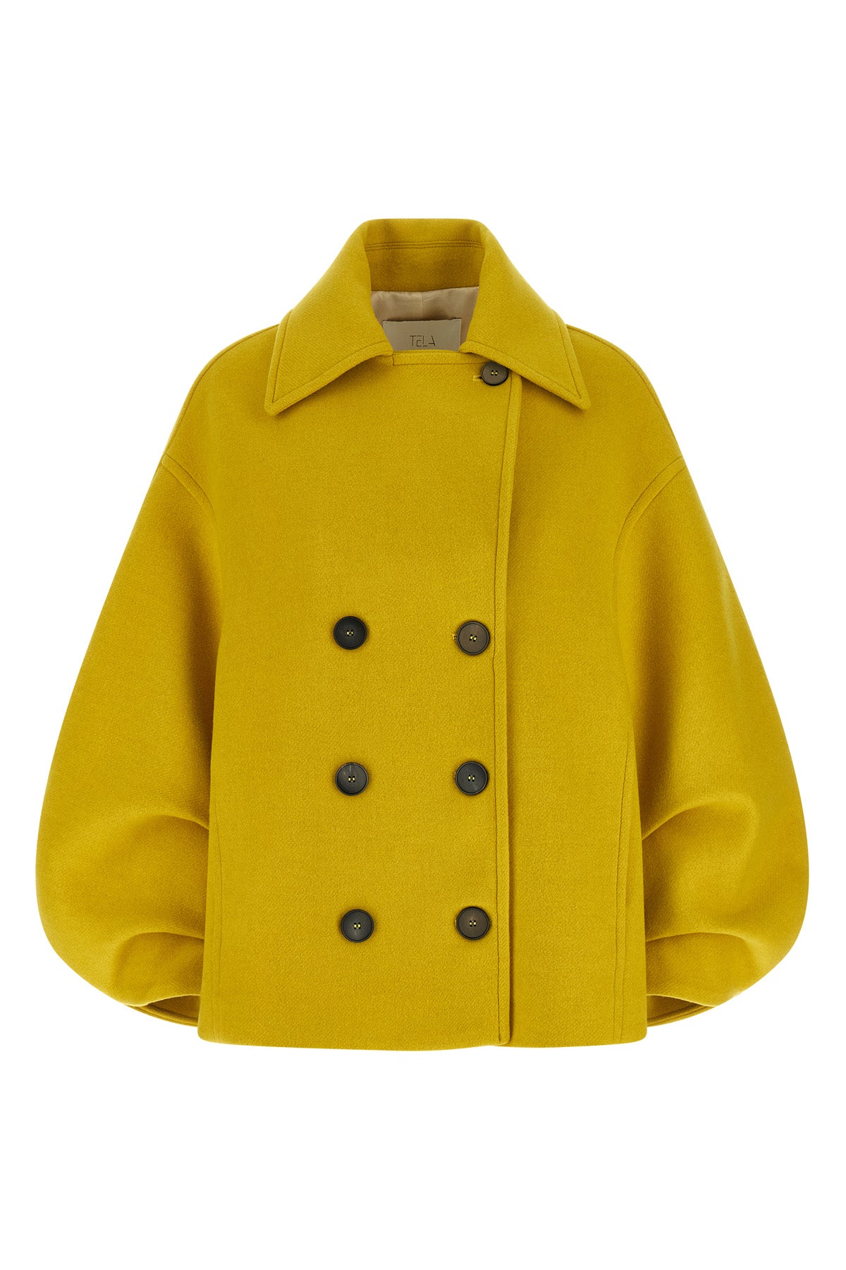the seth tela coat redefines the outerwear through a bold and structured silho