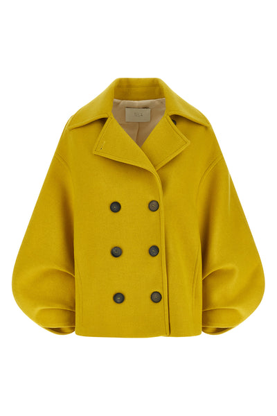 the seth tela coat redefines the outerwear through a bold and structured silho