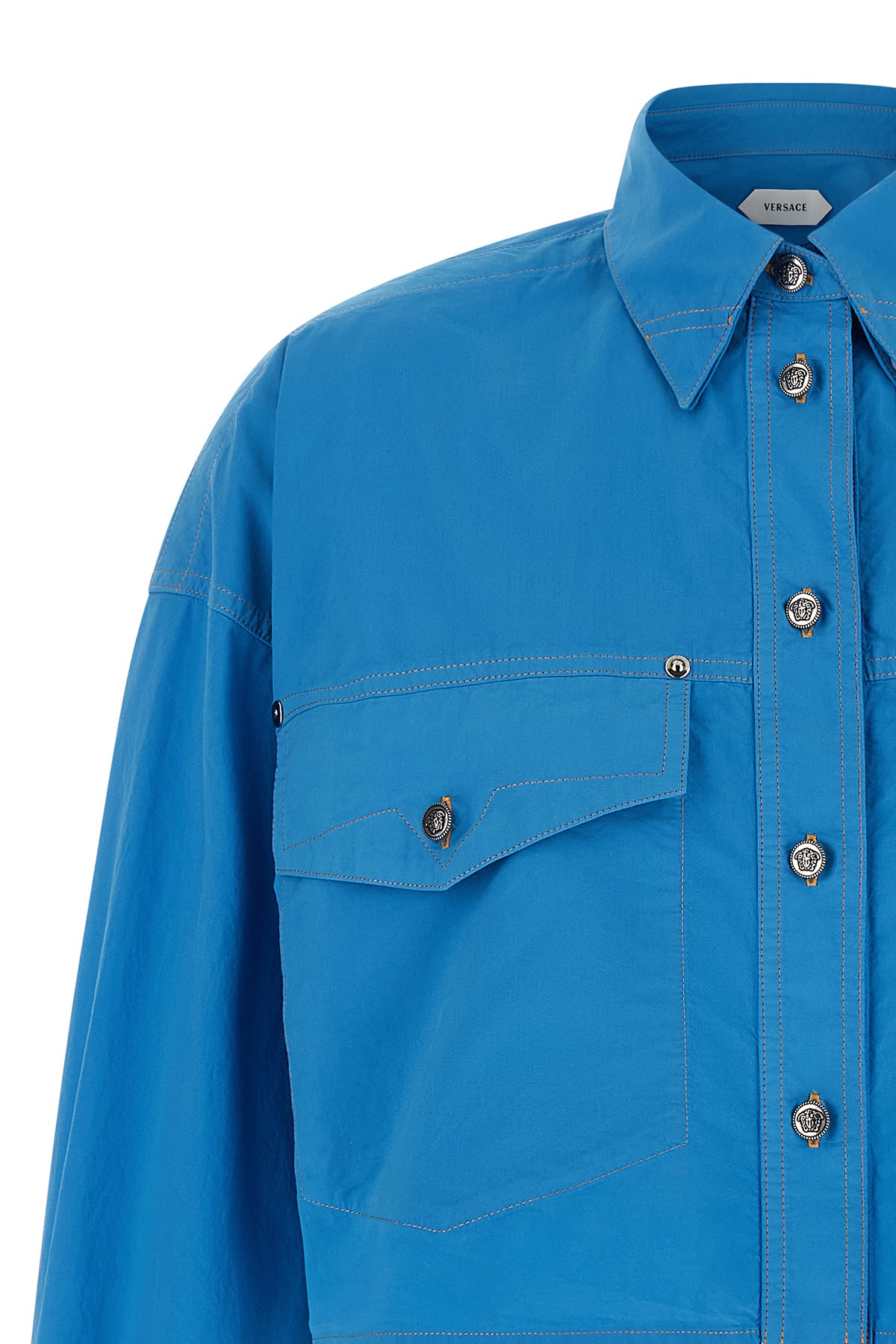 the versace cropped shirt redefines informal tailoring through a shortened and p
