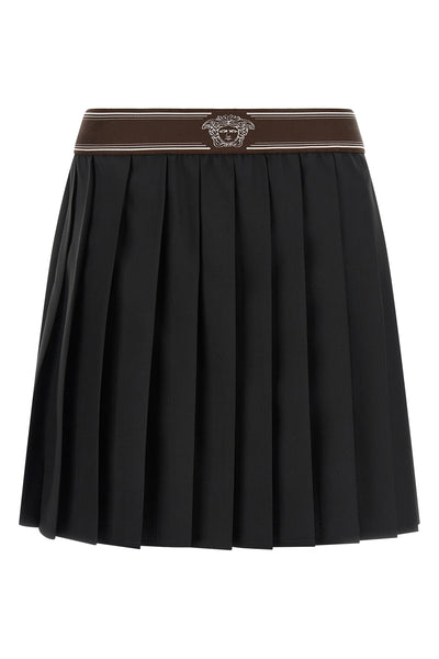 the versace pleated mini skirt exemplifies sartorial precision through its struc