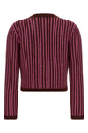 versaces wool knit cardigan defines a new sartorial aesthetic through meticulou