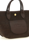 the longchamp xs le pliage handbag defines a compact basket silhouette
