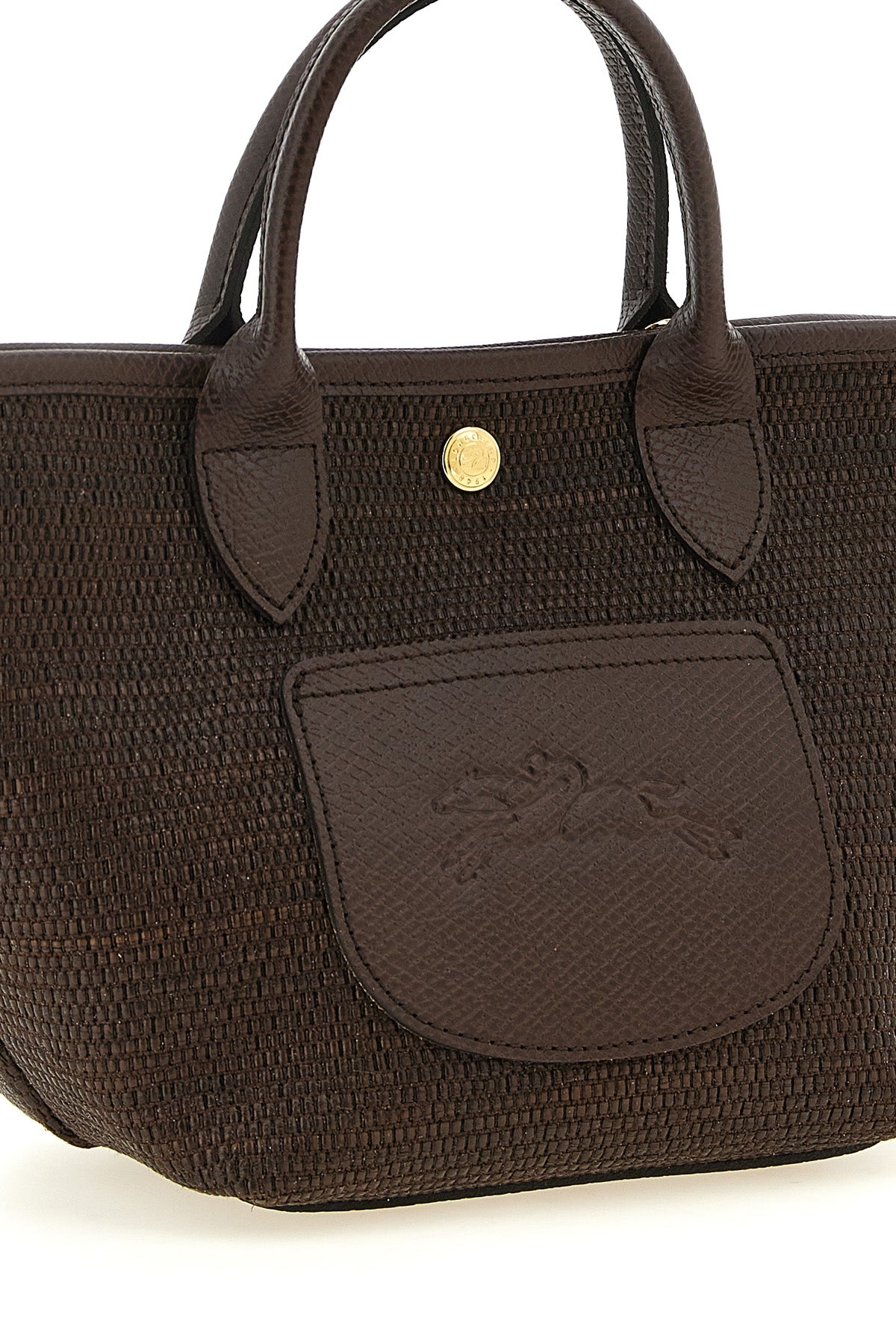 the longchamp xs le pliage handbag defines a compact basket silhouette