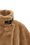 the pinko cape redefines the volumes of outerwear through an enveloping and stru