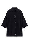 the pinko caban redefines the volumes of the outerwear through a cape silhouette