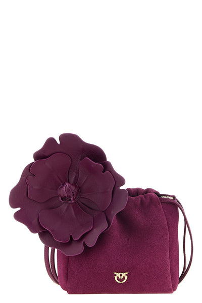 the pinko flower pouch redefines the volumes of leather goods through a soft a