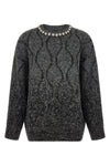 the pinko renault sweater redefines knitwear codes through oversized volumes a