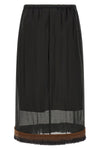 the tela ophelia skirt redefines volumes through a sophisticated play of overlap