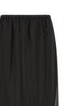 the tela ophelia skirt redefines volumes through a sophisticated play of overlap