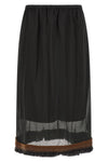 the tela ophelia skirt redefines volumes through a sophisticated play of overlap