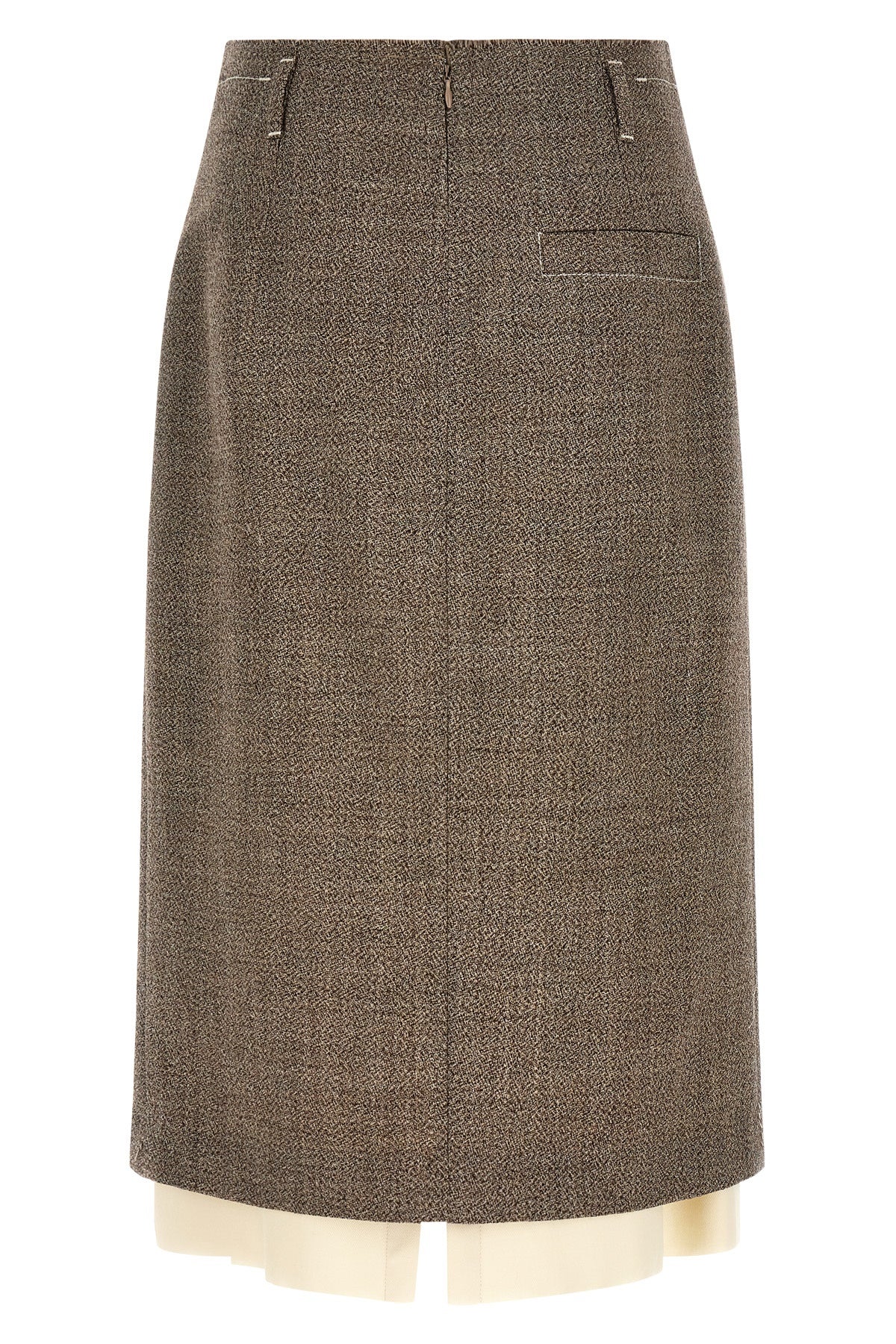 the midi skirt tela redefines the codes of contemporary tailoring through a play